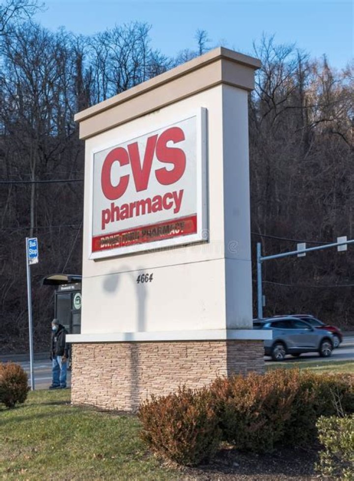 A CVS Pharmacy store sign at night is shown in Houston, Texas, USA. CVS Pharmacy is an American retail corporation.