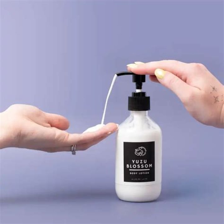 black hands pumping lotion