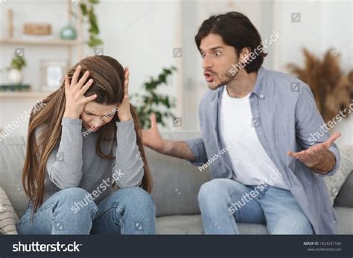 Couple yelling and having an argument on couch