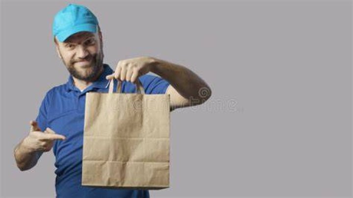 Delivery guy holding bag