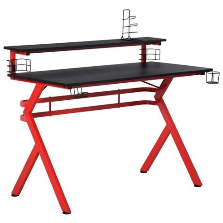 Desk with red cup and red notebook