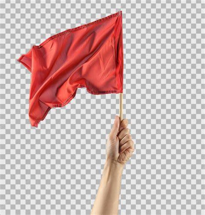 Hand holding a red solo cup at a party