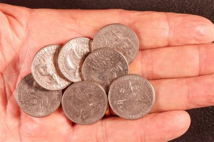 Man holding quarters
