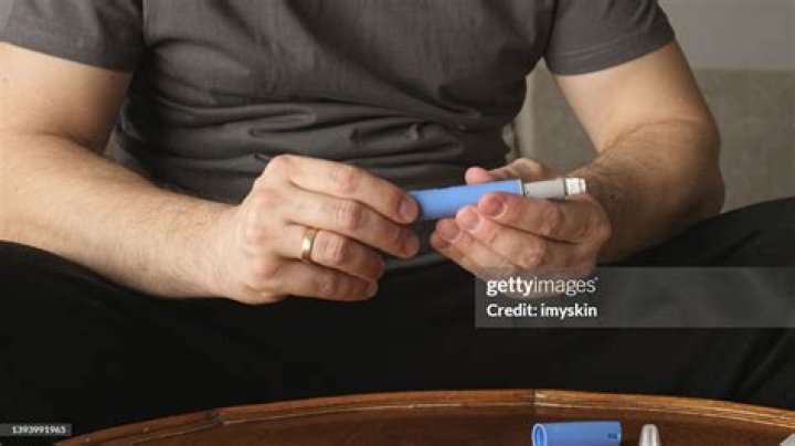 man preparing Semaglutide Ozempic injection control blood sugar levels