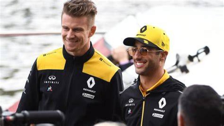 Nico Hülkenberg and Daniel Ricciardo playing Cricket on the sidelines of the 2019 British Grand Prix at the Silverstone Circuit