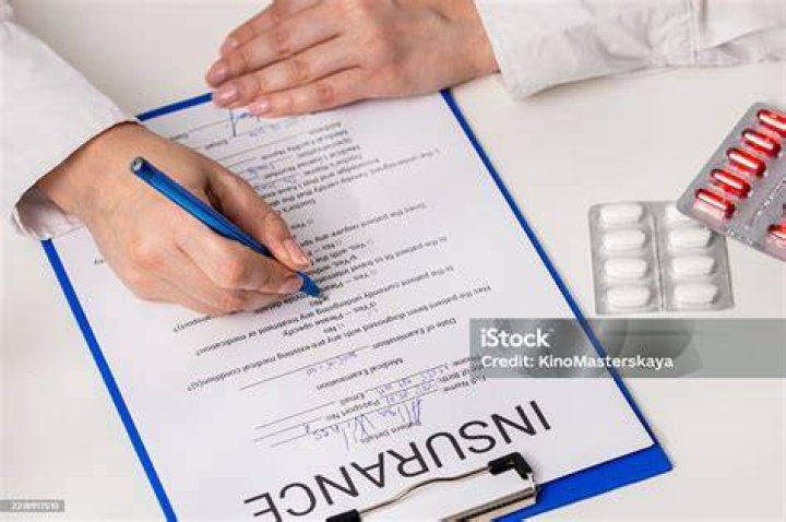 Signing insurance papers